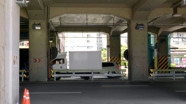 Vehicles passing under a city overpass