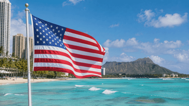 American flag waving by the beach