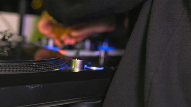 DJ mixing music on a turntable