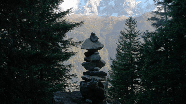 Stone tower with mountain in background