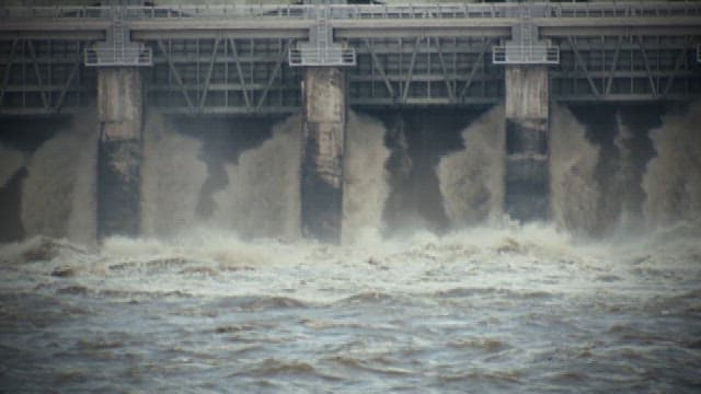 Water gushing powerfully through a dam