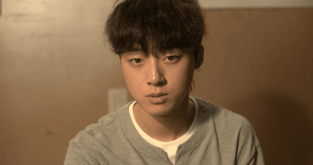 Young man with blank expression