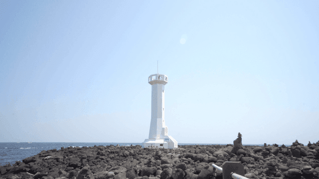 White lighthouse on rocky coast