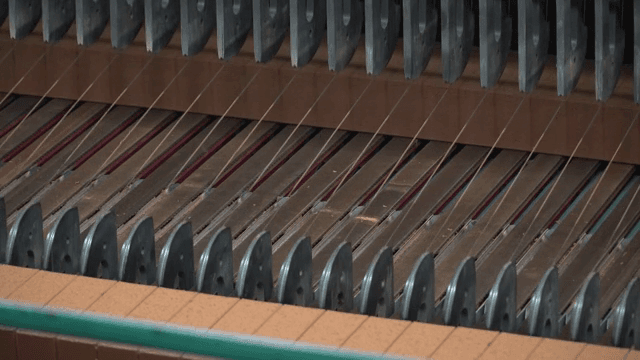 Machine cutting bricks in a factory