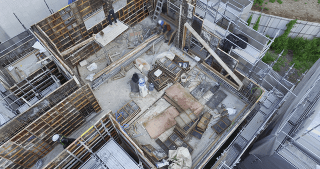 Construction site with workers in helmets