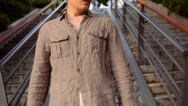 Man sitting on decorative stone stairs