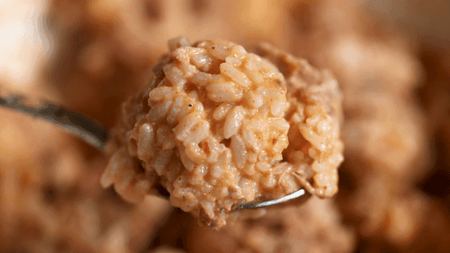 Spoonful of rice mixed with soybean paste and potato stew