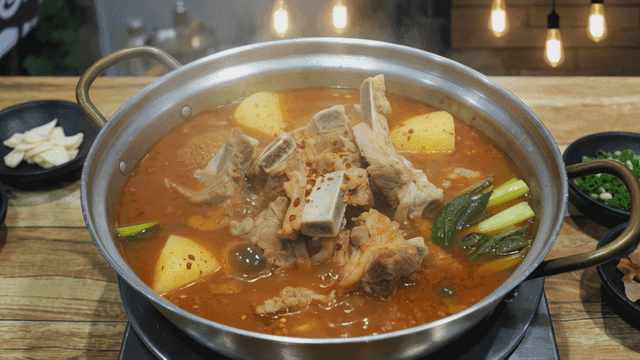 Potato stew boiling in pot