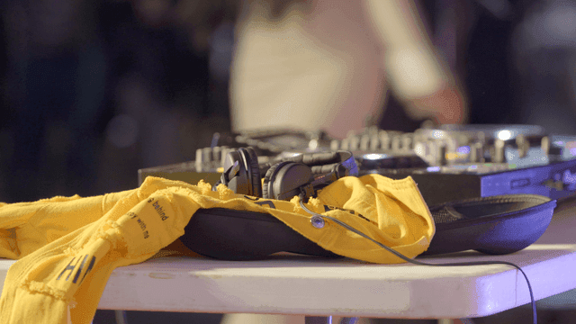 DJ equipment with headphones and yellow cloth