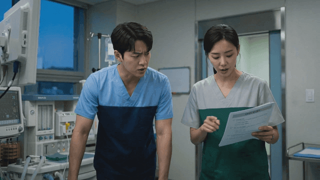 Doctors discussing patient data in a hospital