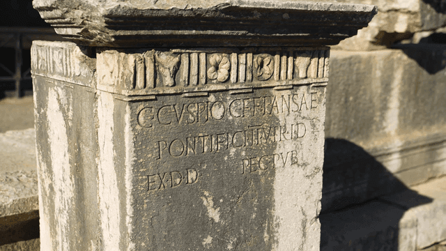 Ancient stone pillar with Latin inscriptions