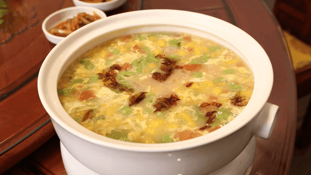 Bowl full of Chinese-style handmade noodle soup with vegetables