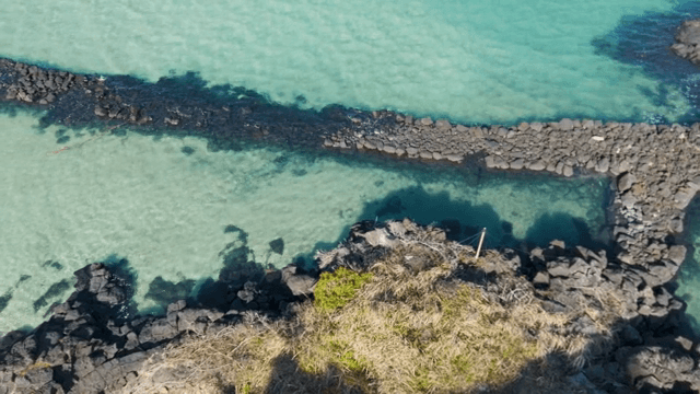 Rocky shoreline with clear turquoise water