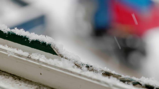 Snow on a rail on a cold winter day