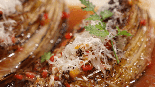 Grilled cabbage with garnish and sauce