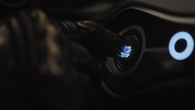 Pushing Car's Engine Start-Stop Button