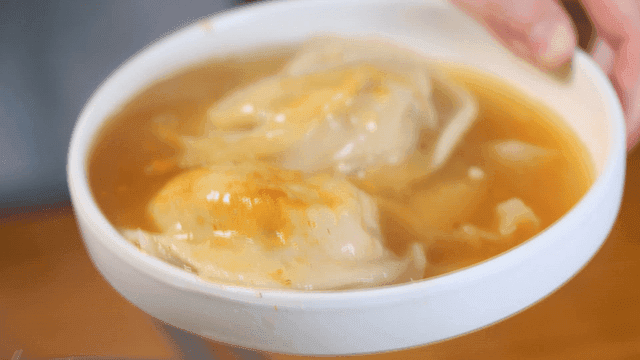 Plate of steaming dumpling soup