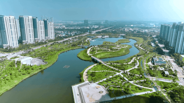 Cityscape with lake and green park