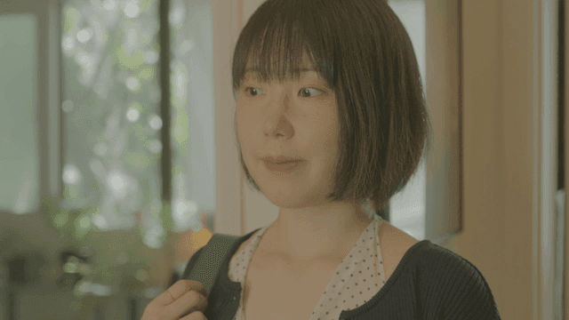 Young woman with bob haircut wearing shoulder bag at home