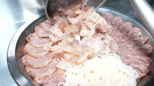 Boiled pork stew with meat and noodles