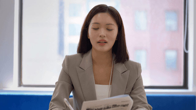 Female interviewer marking documents in office