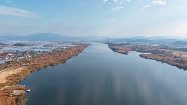 Wide river flowing through a rural landscape