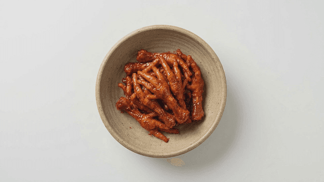 Spicy chicken feet in a bowl