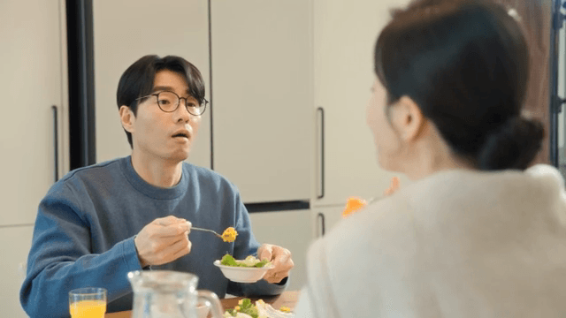 Couple enjoying a meal together at home