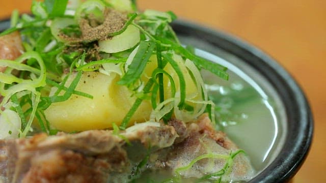 Braised pork backbone with clear soup in an hot pot