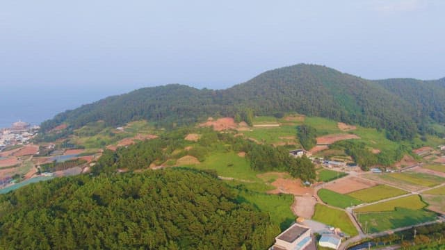 Rural village surrounded by lush mountains