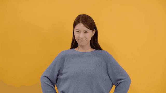 Long haired woman smiling and posing confidently