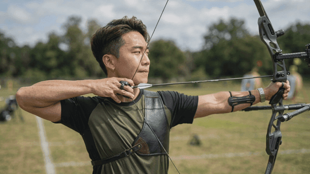 Archer aiming at target