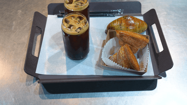 Tray with iced coffee and pastries