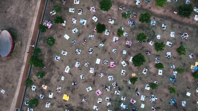 People enjoying a picnic in a scenic park
