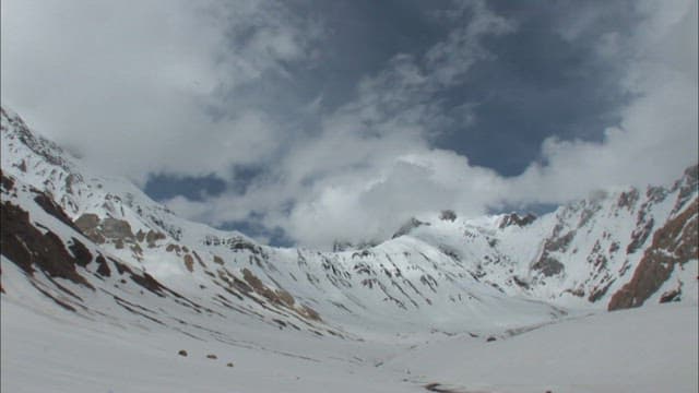 Snowy Majestic Spantik Gold Peak under Cloudy Sky