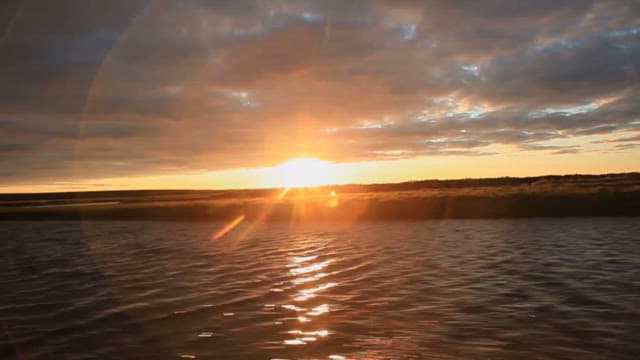 Serene Sunset Over Calm Waters