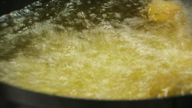 Frying potato croquette batter in hot oil