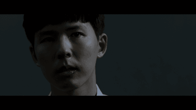 Man speaking with bruised lips in dark room