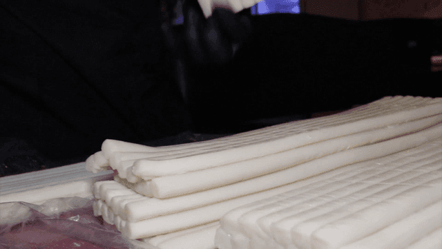 Rice cake being prepared indoors