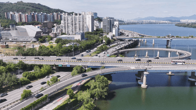Bustling city highway by river