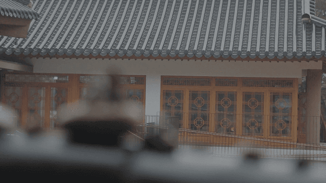 Traditional Hanok behind piled stones