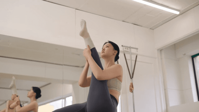 Woman practicing pilates indoors