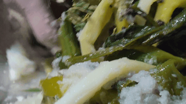 Vegetables and herbs mixing in bowl