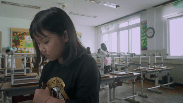 Students cleaning the classroom