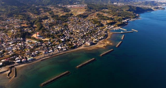 Coastal village with mountains and sea