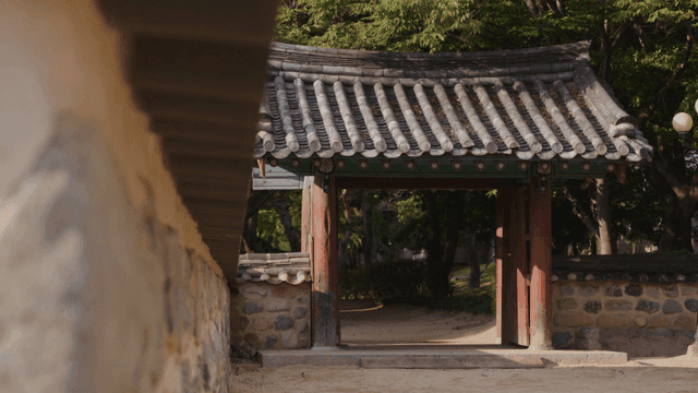 Traditional Hanok gate in tranquil garden