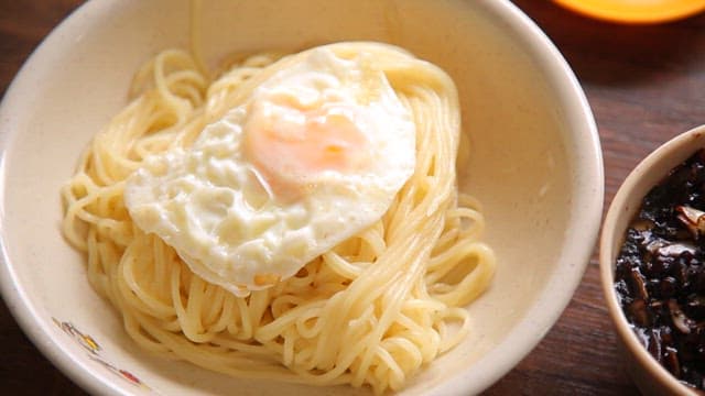 Noodles and thick black bean sauce set on the table