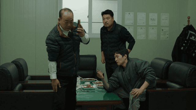 Man going out to answer phone call while arm wrestling