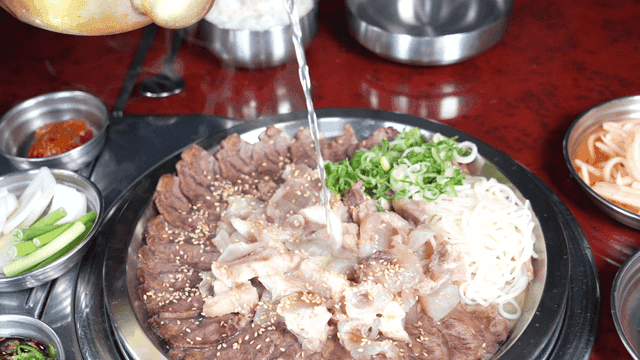 Warm boiled pork stew with broth poured over it