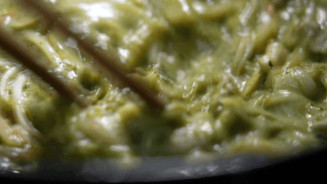 Green stew simmering with vegetables